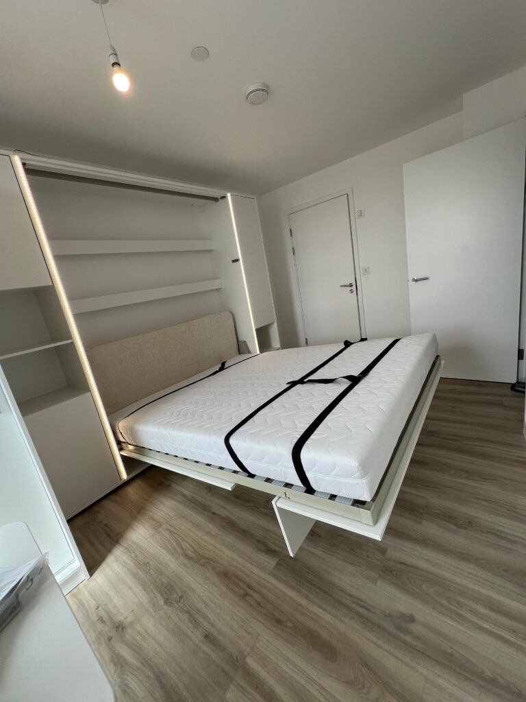 Folding wall bed