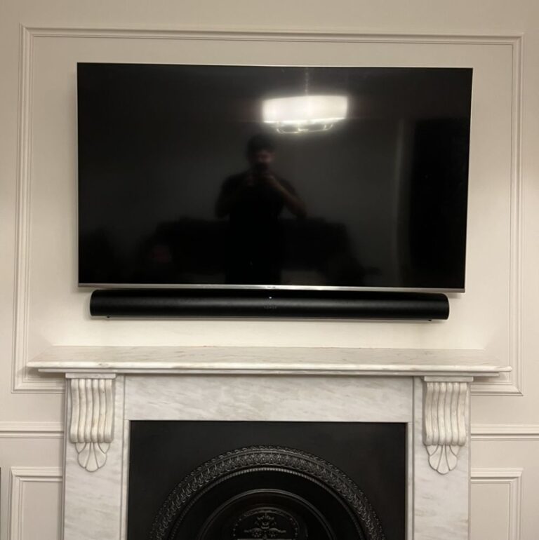 TV mounted above a fireplace